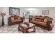 Comfortable living room featuring tiled floors, neutral decor, and lots of seating for entertaining at 2645 Heritage Ct, Las Vegas, NV 89121