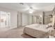 Bright main bedroom with walk-in closet access and a ceiling fan at 2645 Heritage Ct, Las Vegas, NV 89121