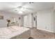Spacious main bedroom with a ceiling fan, soft carpeting, and neutral decor at 2645 Heritage Ct, Las Vegas, NV 89121