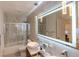 Bathroom featuring updated fixtures, including an illuminated mirror and a glass enclosed shower at 2649 Golden Sands Dr, Las Vegas, NV 89128