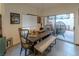 Dining area featuring rustic furniture and a view of outdoor seating at 2649 Golden Sands Dr, Las Vegas, NV 89128