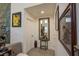 Hallway featuring tile floors, neutral paint and decorative mirrors and artwork at 2649 Golden Sands Dr, Las Vegas, NV 89128