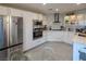 Modern white kitchen with stainless steel appliances and marble countertops at 2649 Golden Sands Dr, Las Vegas, NV 89128