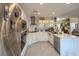 Bright, modern kitchen with stainless steel appliances, white cabinets, and a marble backsplash at 2649 Golden Sands Dr, Las Vegas, NV 89128