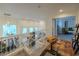 Bright loft area with high ceilings, large windows, and a view of the downstairs living space at 2649 Golden Sands Dr, Las Vegas, NV 89128