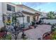 Inviting backyard patio featuring stone pavers, comfortable seating, and well-maintained landscaping at 2649 Golden Sands Dr, Las Vegas, NV 89128