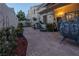 Relaxing backyard patio with stone pavers, lush greenery, and stylish outdoor decor at 2649 Golden Sands Dr, Las Vegas, NV 89128