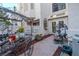 Picturesque backyard patio with stone pavers, elegant decor, and access to the home's interior at 2649 Golden Sands Dr, Las Vegas, NV 89128