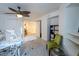 Multi-use room with ceiling fan, tiled flooring and view to the second story loft at 2649 Golden Sands Dr, Las Vegas, NV 89128