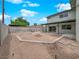 Spacious backyard featuring a fire pit and potential for outdoor living and landscaping at 2761 Phoenix St, Las Vegas, NV 89121