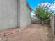 View of the side yard featuring some greenery and brick pavers that lead to the back of the home at 2761 Phoenix St, Las Vegas, NV 89121