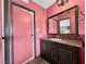 Bathroom with a vanity and a large mirror, and a door to a closet at 2761 Phoenix St, Las Vegas, NV 89121