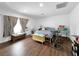 This bedroom has hardwood floors, a bench at the foot of the bed, and nice decor at 2761 Phoenix St, Las Vegas, NV 89121