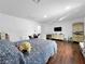 Spacious bedroom with hardwood floors, white walls, and a large window for natural lighting at 2761 Phoenix St, Las Vegas, NV 89121