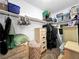 Walk-in closet with clothes hanging on a rod and assorted storage boxes and furniture at 2761 Phoenix St, Las Vegas, NV 89121