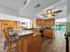 Well-lit kitchen with granite countertops and adjacent view to a dining area at 2761 Phoenix St, Las Vegas, NV 89121