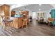 Open floorplan with kitchen island and bar seating adjacent to dining and living areas at 2761 Phoenix St, Las Vegas, NV 89121