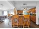 Eat-in kitchen with bar seating, wood cabinets and floors, and modern appliances at 2761 Phoenix St, Las Vegas, NV 89121