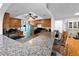 Kitchen boasts granite countertops, wood cabinetry, and an open floor plan with bar seating at 2761 Phoenix St, Las Vegas, NV 89121