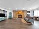 Spacious living room features a brick fireplace and hardwood floors at 2761 Phoenix St, Las Vegas, NV 89121