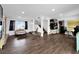 Open-concept living room with wood laminate floors and staircase at 2761 Phoenix St, Las Vegas, NV 89121