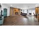 Large living room with wood floors, brick fireplace, and ample natural light at 2761 Phoenix St, Las Vegas, NV 89121