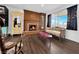 Cozy living room featuring a fireplace and large picture window at 2761 Phoenix St, Las Vegas, NV 89121