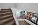 Carpeted staircase with white railings provides access to the upper level and a glimpse of the living area at 2761 Phoenix St, Las Vegas, NV 89121