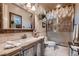 Primary bathroom showcasing a vanity with mirror, shower, and stylish decor at 2845 Red Arrow Dr, Las Vegas, NV 89135