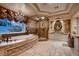 Lavish bathroom features a soaking tub, dual vanities, and luxurious walk-in shower at 2845 Red Arrow Dr, Las Vegas, NV 89135