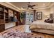 Bedroom features include a bed, built-in shelving, hardwood floors and direct access to the balcony at 2845 Red Arrow Dr, Las Vegas, NV 89135