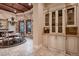Bright dining room featuring stone wall accents, a chandelier, and custom cabinetry at 2845 Red Arrow Dr, Las Vegas, NV 89135