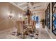 Elegant dining room featuring a chandelier, decorative mirrors, and a colorful rug, perfect for gatherings at 2845 Red Arrow Dr, Las Vegas, NV 89135