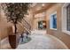 Grand foyer showcasing a staircase, chandelier lighting, and views into the formal living spaces at 2845 Red Arrow Dr, Las Vegas, NV 89135