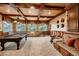 Game room with pool table, large windows, and a built in upholstered bench at 2845 Red Arrow Dr, Las Vegas, NV 89135