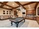Finished basement game room with pool table, wet bar, and built-in seating at 2845 Red Arrow Dr, Las Vegas, NV 89135