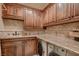 Laundry room boasts wood cabinets, light countertops, and a washer-dryer set at 2845 Red Arrow Dr, Las Vegas, NV 89135