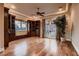 Living room boasts hardwood floors, a private balcony and custom built-in shelving at 2845 Red Arrow Dr, Las Vegas, NV 89135
