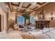 Elegant living room with coffered ceilings, decorative fireplace, and large windows offering natural light and neighborhood views at 2845 Red Arrow Dr, Las Vegas, NV 89135