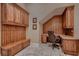 Mud room showcasing a built-in desk, seating, and storage cabinets at 2845 Red Arrow Dr, Las Vegas, NV 89135