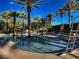Community pool with a lifeguard station, clear blue water and surrounding lounge seating at 2845 Red Arrow Dr, Las Vegas, NV 89135