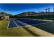 Community tennis court with well-maintained surface and mountain views in the background at 2845 Red Arrow Dr, Las Vegas, NV 89135
