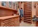 Custom walk-in closet featuring wood cabinetry, drawers, and shelving at 2845 Red Arrow Dr, Las Vegas, NV 89135