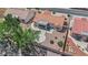 Overhead view of a home with a tile roof, desert landscaping, and a covered patio at 3000 Morning Ridge Dr, Las Vegas, NV 89134