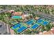 Aerial view of resort-style community amenities including tennis courts, a pool, and meticulously landscaped grounds at 3000 Morning Ridge Dr, Las Vegas, NV 89134
