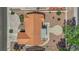 Aerial view of a house with a tile roof, desert landscaping, and a backyard patio at 3000 Morning Ridge Dr, Las Vegas, NV 89134
