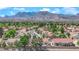 Panoramic aerial view showcases the neighborhood's lush landscaping, and beautiful mountain backdrop at 3000 Morning Ridge Dr, Las Vegas, NV 89134