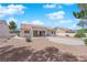 Expansive backyard with desert landscaping, covered patio, and clear blue skies at 3000 Morning Ridge Dr, Las Vegas, NV 89134