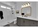 Modern bathroom with a stylish vanity, quartz countertop, and walk-in shower with beautiful marble tiling at 3000 Morning Ridge Dr, Las Vegas, NV 89134