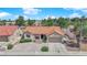 Charming home with a tile roof, desert landscaping, and an attached garage at 3000 Morning Ridge Dr, Las Vegas, NV 89134